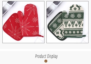 Detail of red and green Christmas oven mitt and pot holder set with Nordic patterns