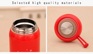 Detail of red Christmas thermos with snowflake patterns and high-quality sealing lid