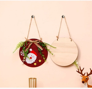 Detail of Christmas wooden sign with red plaid fabric Santa and artificial greenery décor