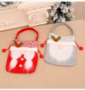 Close-up of red and grey gnome gift bags with plush beards and drawstring closure