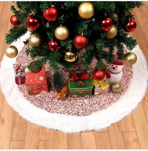 Macro detail of pink sequins and white plush faux fur trim on a Christmas tree skirt