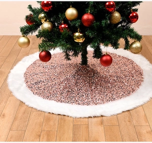 Detail of rose gold sequin Christmas tree skirt with plush white faux fur trim border