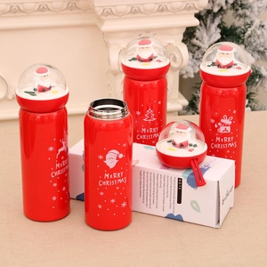 Red Christmas thermos with Santa snow globe lid and festive reindeer graphics