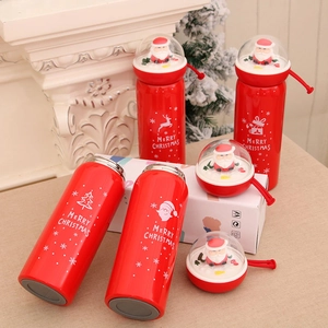 Red Christmas thermos bottle with Santa Claus lid and festive Merry Christmas patterns