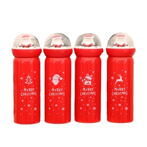 Set of four red Christmas thermos cups with Santa Claus crystal ball lids and holiday patterns