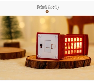 Macro detail of Christmas phone booth lantern base with battery compartment and power switch