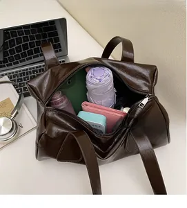 Top view of deep brown oily wax leather tote bag showing spacious interior and storage capacity