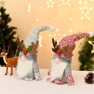 Christmas gnomes set with reindeer antlers and knit hats for holiday tabletop decoration