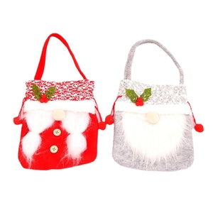 Red and grey Christmas gnome gift bags with plush white beards for holiday treats