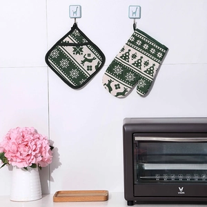 Christmas kitchen set with heat resistant glove and pot holder in green forest pattern