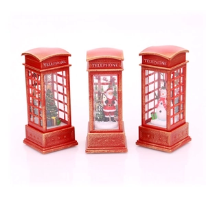 Three red vintage Christmas telephone booth lanterns with Santa, snowman and tree scenes