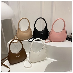 Minimalist crescent handbags in khaki, black, pink, brown, and white on display