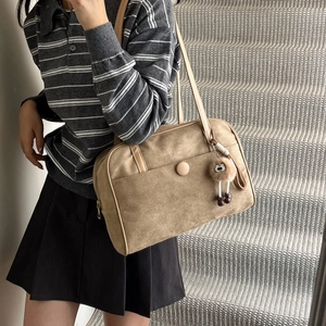 Vintage khaki suede tote bag with plush charm and large capacity for shoulder wear