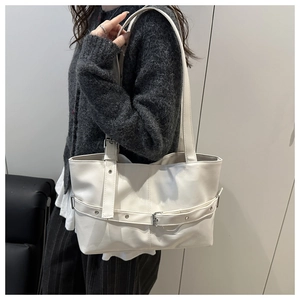 Large capacity white PU leather tote bag with buckle detail on a female model shoulder