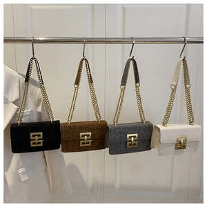Detail showing four stylish crossbody bags in black and leopard patterns with gold chains