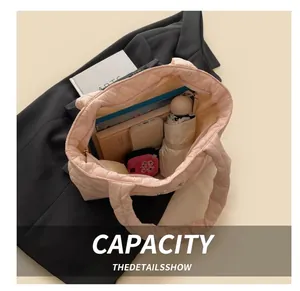 Pink quilted tote bag interior view showing large storage capacity for daily essentials