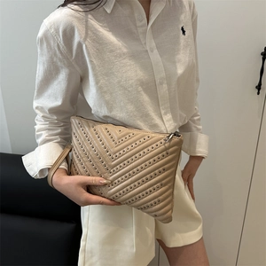 Minimalist beige quilted envelope bag with silver rivets and wrist strap for women