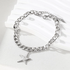 Stainless steel Cuban link anklet with starfish pendant on white wave display