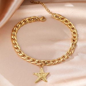 Gold stainless steel curb chain anklet with hammer textured starfish charm on pink satin