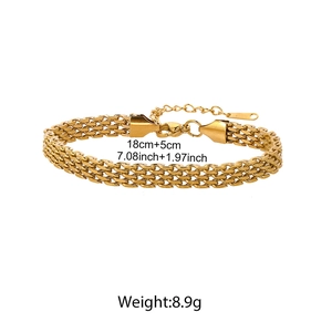 Macro shot of 18K gold braided mesh chain bracelet with lobster clasp and extender