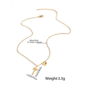 Detail showing gold cross and heart pendant size dimensions on a necklace