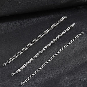 Three-piece stainless steel bracelet set featuring Cuban, Byzantine, and link chain styles