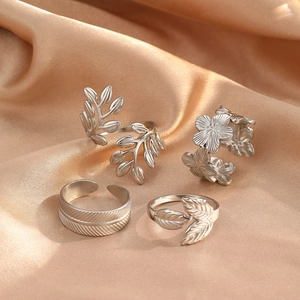 Adjustable stainless steel ring set featuring nature-inspired leaf and flower designs
