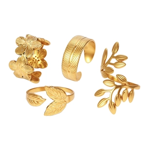 Adjustable 4-piece gold stainless steel ring set featuring leaf flower and feather motifs