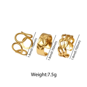 Detail of three gold rings showing hollow layers, diamond texture, and braided chain patterns