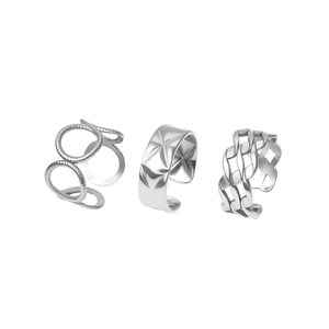 Detailed close-up of adjustable silver-tone geometric rings with quilted and hollow designs