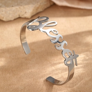 Polished stainless steel open cuff bracelet with cutout Blessed lettering art