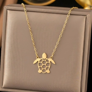 Gold stainless steel necklace featuring a minimalist hollow turtle pendant on a delicate chain
