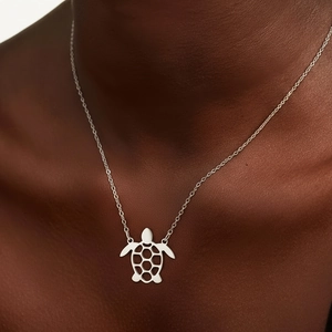 Minimalist silver turtle pendant necklace in polished stainless steel for women