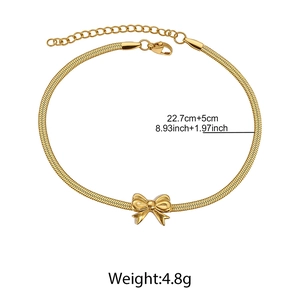 Detail of 18K gold snake chain with butterfly pendant and length adjustment scale