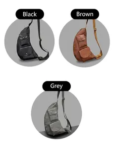Three leather crossbody bags in black, brown, and grey with adjustable straps
