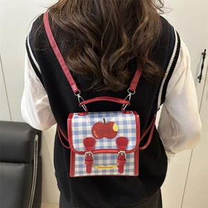 Blue and white checkered mini backpack with red apple graphic and dual straps