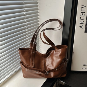 Minimalist large brown PU leather tote bag with silver eyelet straps and vintage design