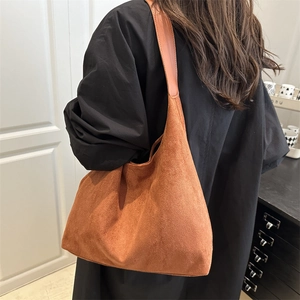 Minimalist brown suede oversized hobo shoulder bag with wide leather strap for women