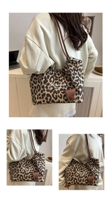 Detail of leopard print tote bag featuring faux suede texture and mini leather pouch