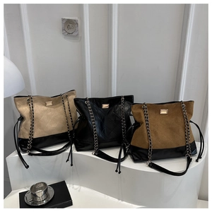 Detailed display of large quilted tote bags in apricot black and brown with chain straps