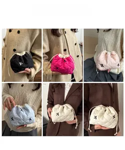 Quilted drawstring cosmetic bags in five colors showing stylish embroidery and texture