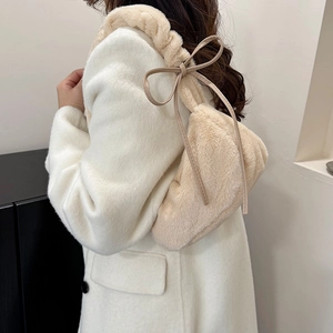 Fluffy beige faux fur hobo bag with cute ribbon bows for autumn fashion trends