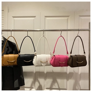Detail shot of crocodile pattern texture on small PU leather flap bags in five colors
