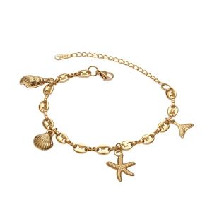 Gold stainless steel ocean bracelet with seashell, conch, starfish, and fishtail charms