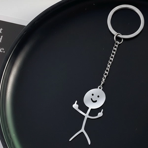 Funny middle finger stickman keychain made of polished stainless steel on black plate