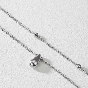 Double-layered stainless steel anklet with silver water-drop pendant and small beads
