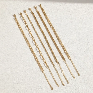 Detailed set of six gold-plated chains including cuban and paperclip styles with lobster clasps