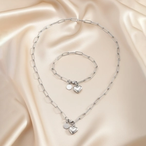 Ensemble collier et bracelet maille trombone avec pendentif cœur poli et petit disque