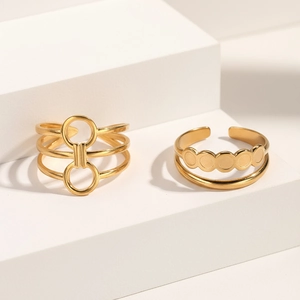 Detail of gold double-layered open ring set with hollow circle and geometric design