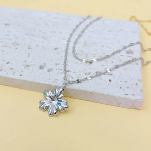 Silver stainless steel double-layered necklace with a multi-petal flower pendant